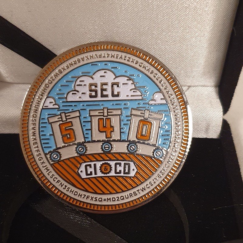 The SANS SEC540 Cloudwars challenge coin in its presentation case